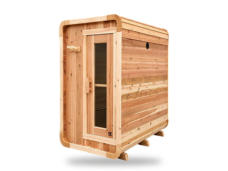 Sweat Kingdom Sweat Pod compact red cedar cube sauna with rounded corners and glass-panel door